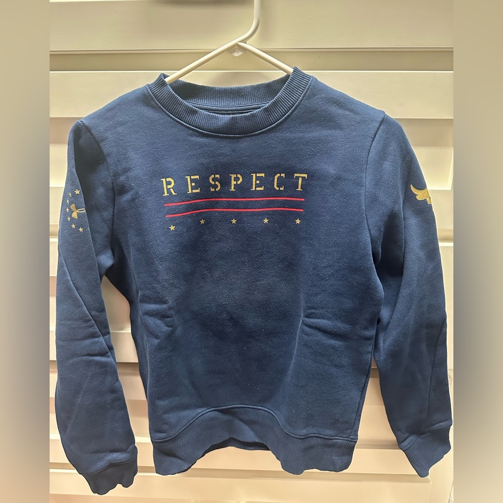 Under Armour Project Rock fleece sweatshirt.